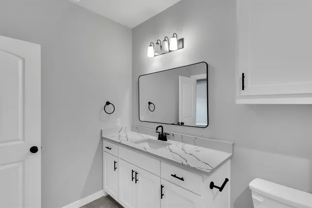 a view of swimming pool with a patio and a yard