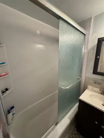 a bathroom with a bathtub and a sink