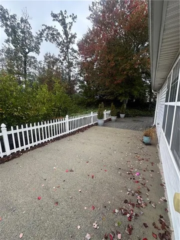 a view of a roof deck with wooden fence