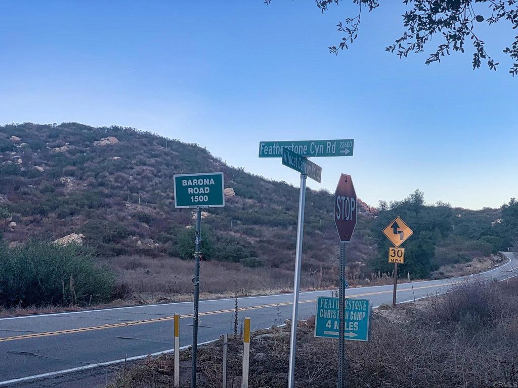 24352 Featherstone Canyon Road Lakeside, CA 92040 - Photo 15 of 72 a view of a house with a yard