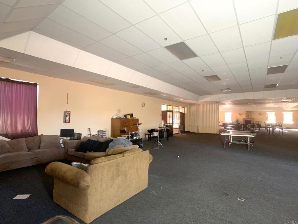 24352 Featherstone Canyon Road Lakeside, CA 92040 - Photo 37 of 72 a living room with furniture and a large window