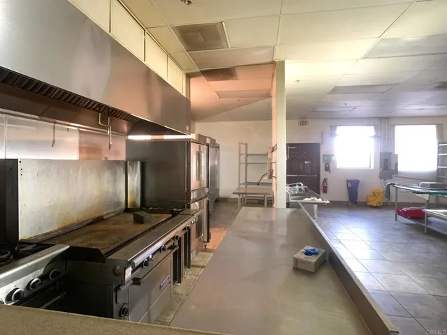 a living room with lots of furniture and appliances