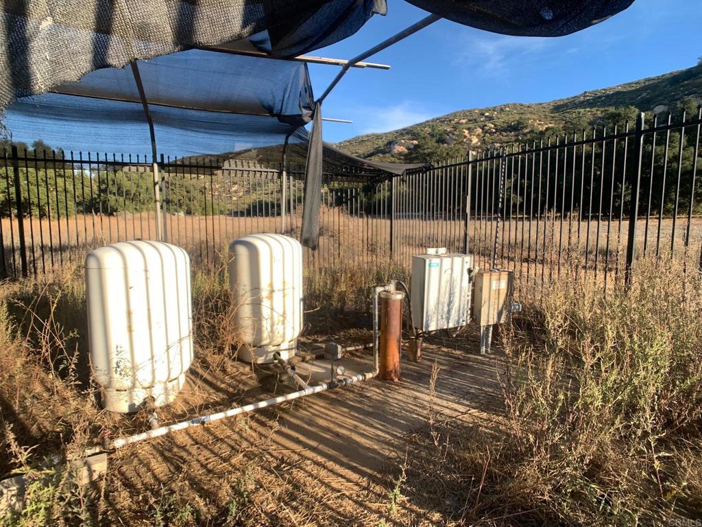 24352 Featherstone Canyon Road Lakeside, CA 92040 - Photo 42 of 72 a view of a backyard with a tv