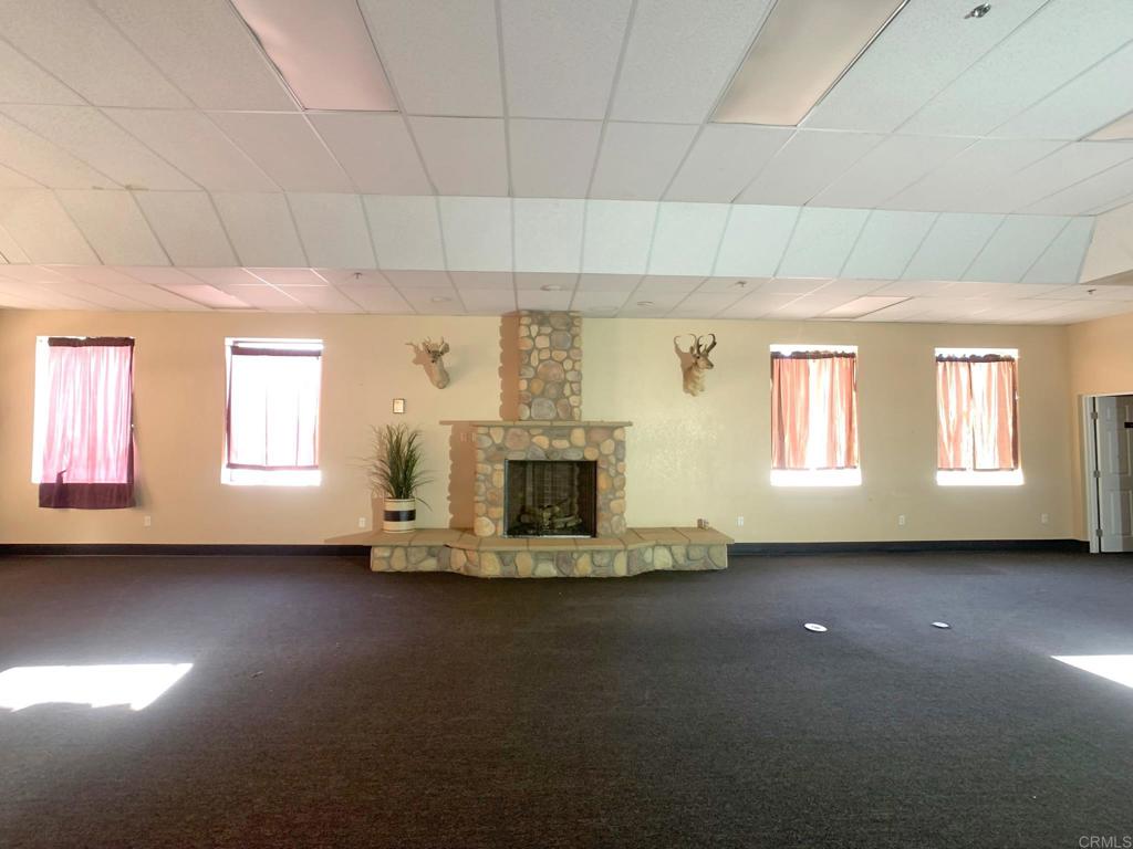 24352 Featherstone Canyon Road Lakeside, CA 92040 - Photo 54 of 72 a view of a livingroom with furniture window and a fireplace