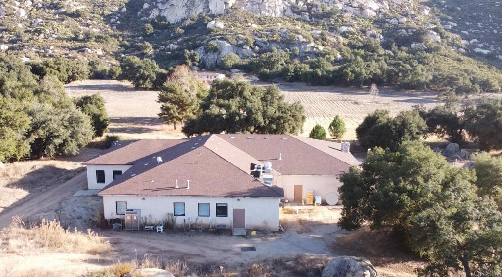 24352 Featherstone Canyon Road Lakeside, CA 92040 - Photo 59 of 72 a aerial view of a house next to a yard with large tree