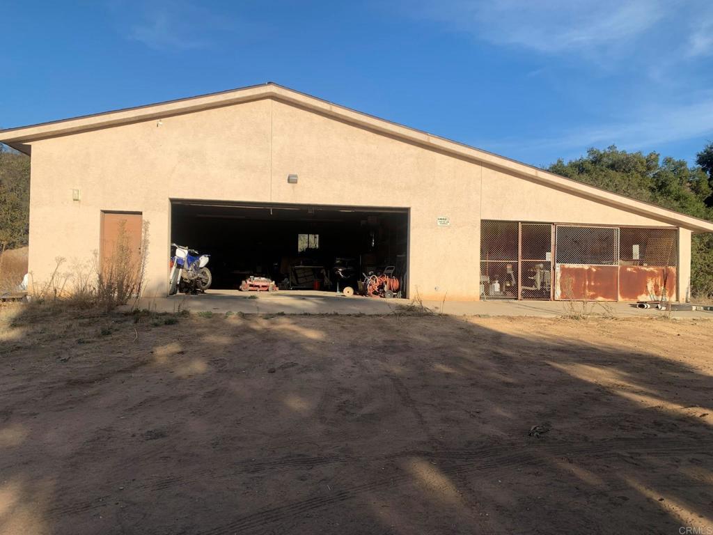 24352 Featherstone Canyon Road Lakeside, CA 92040 - Photo 69 of 72 a front view of a house with a yard