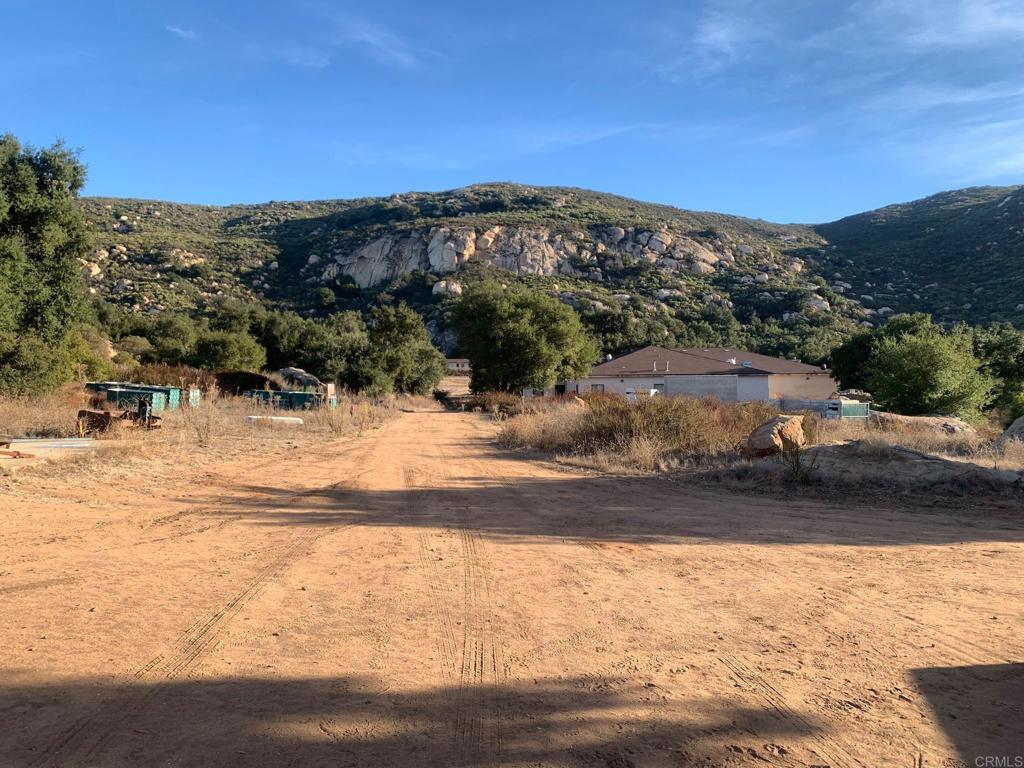 24352 Featherstone Canyon Road Lakeside, CA 92040 - Photo 70 of 72 a view of a yard with a snow in the background
