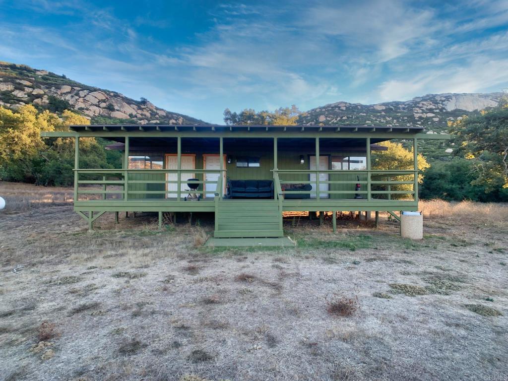 24352 Featherstone Canyon Road Lakeside, CA 92040 - Photo 7 of 72 a view of a house with a yard and sitting area