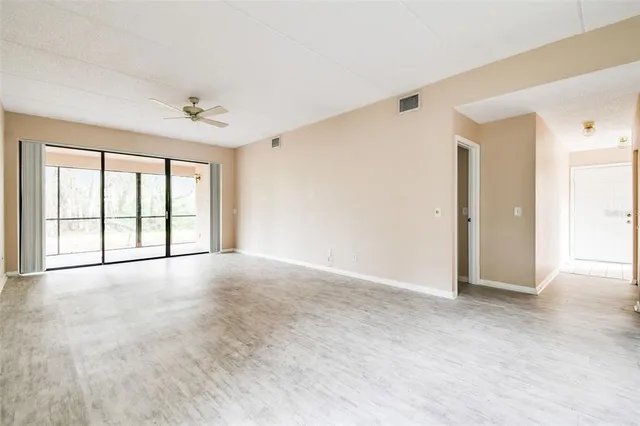 a view of an empty room with a window