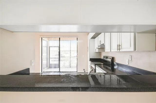 a living room with a couch and a large window