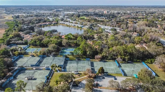 an aerial view of a house with a lake view