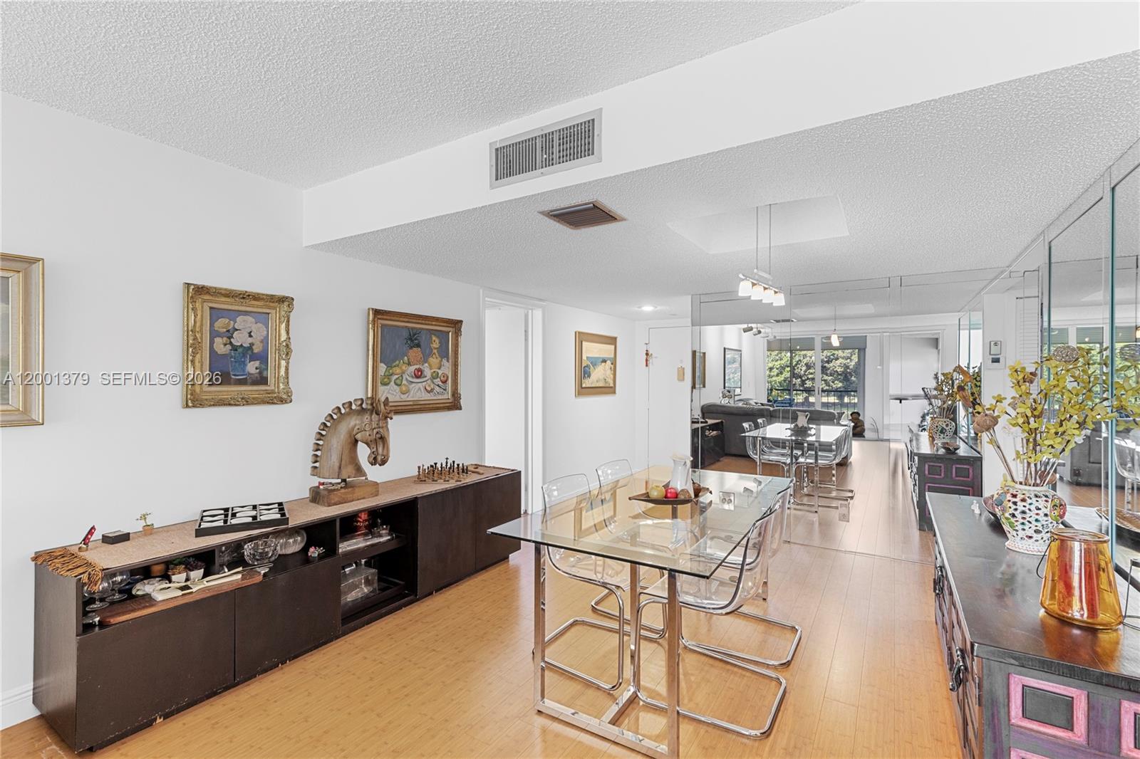 16251 Golf Club Road, Unit 311 Weston, FL 33326 - Photo 16 of 38 a living room with furniture and wooden floor