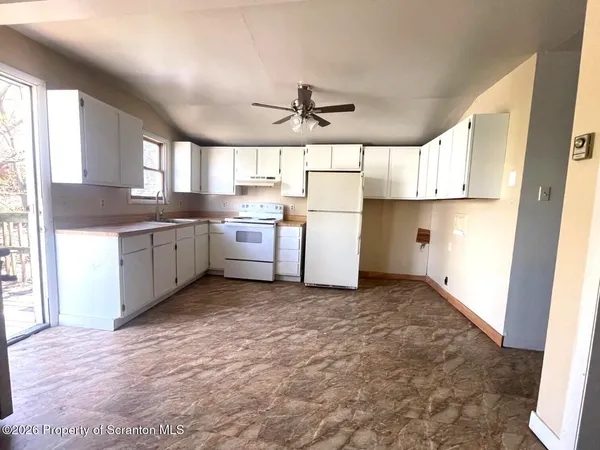 a kitchen with sink cabinets and window