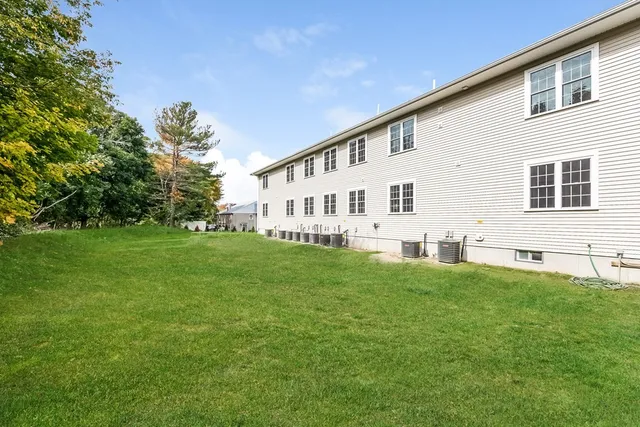a view of house with backyard