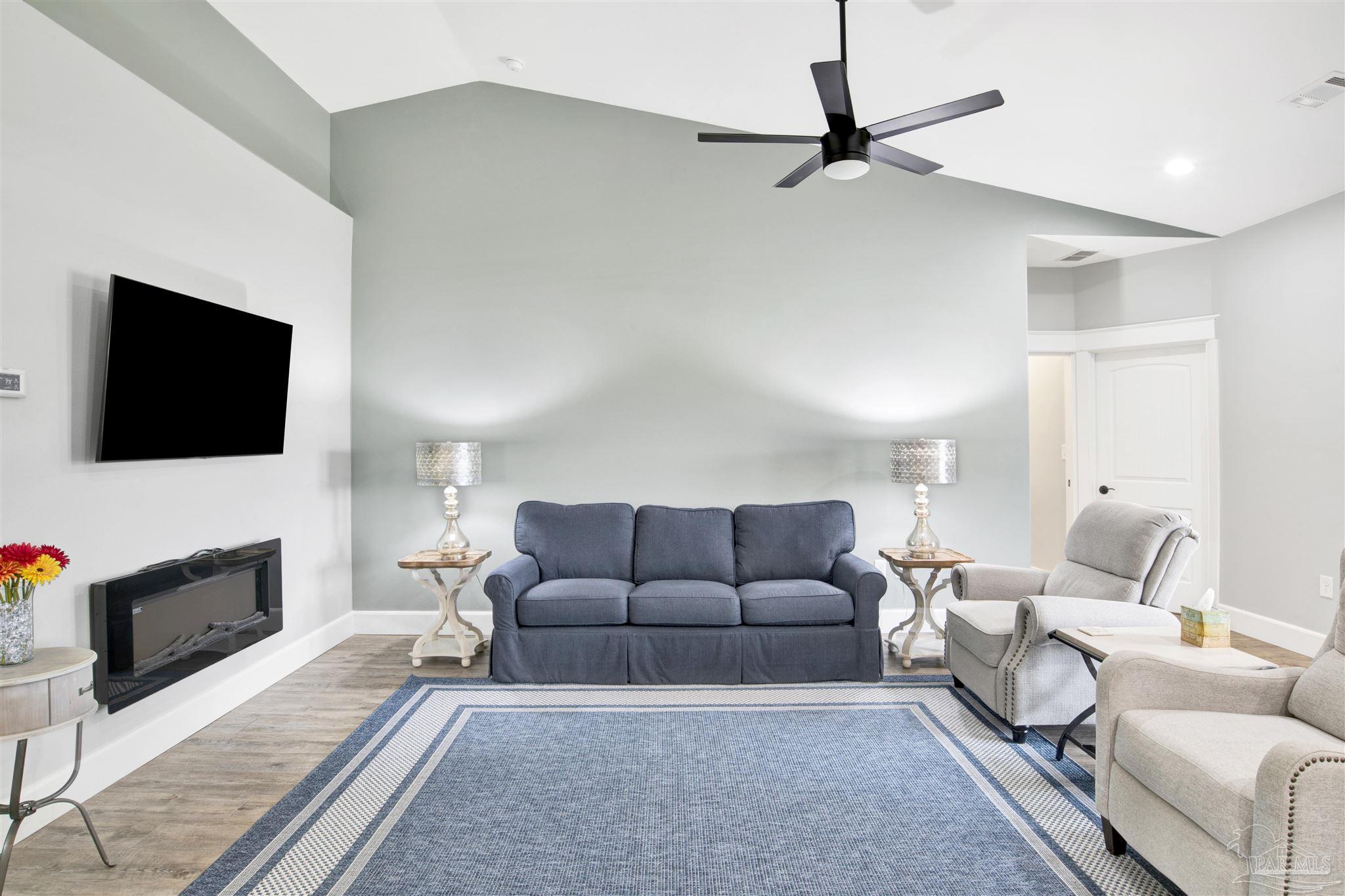 2549 Santa Rosa Drive Lillian, AL 36549 - Photo 15 of 53 a living room with furniture and a flat screen tv