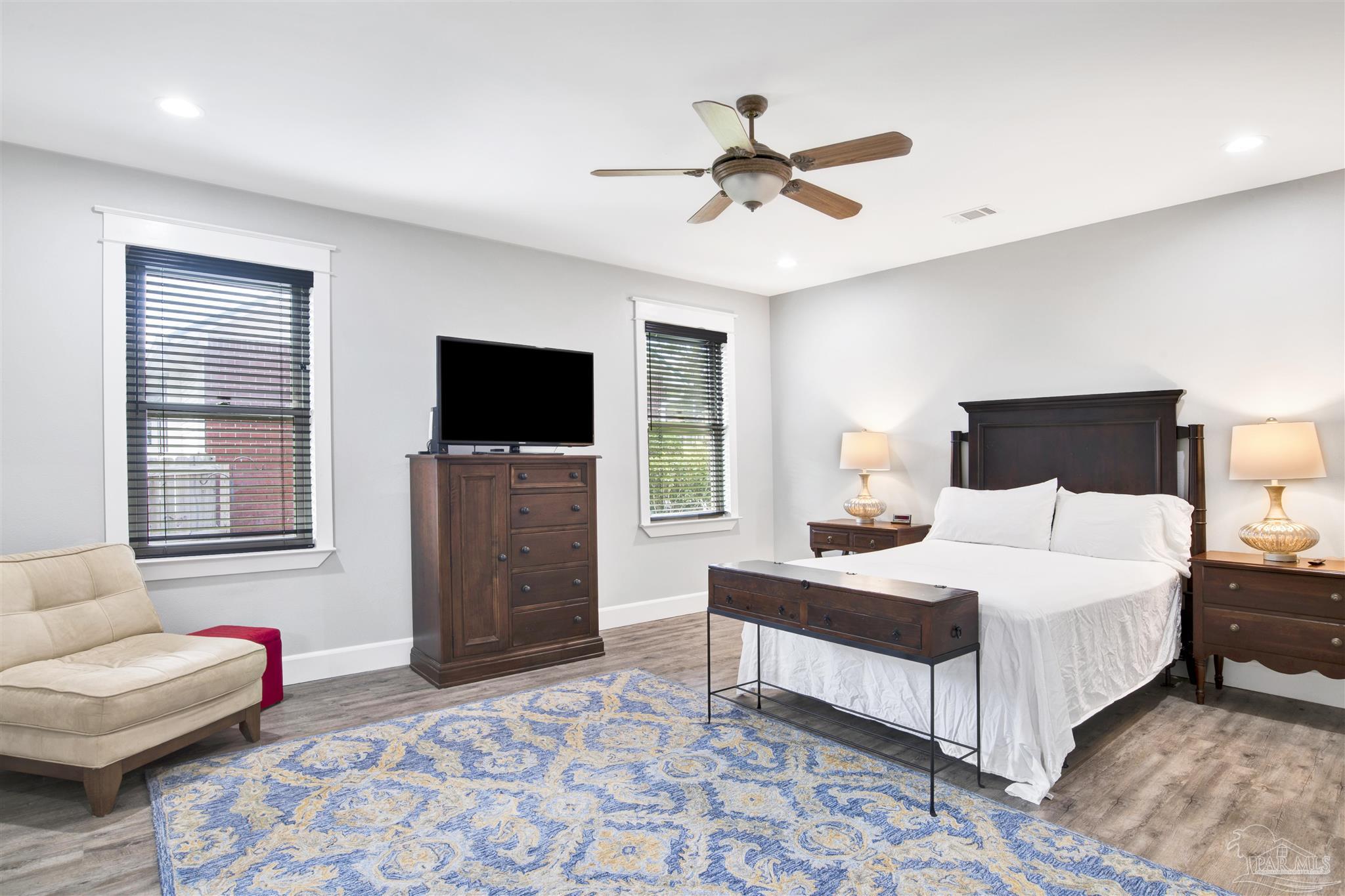 2549 Santa Rosa Drive Lillian, AL 36549 - Photo 17 of 53 a bedroom with a bed and a flat screen tv