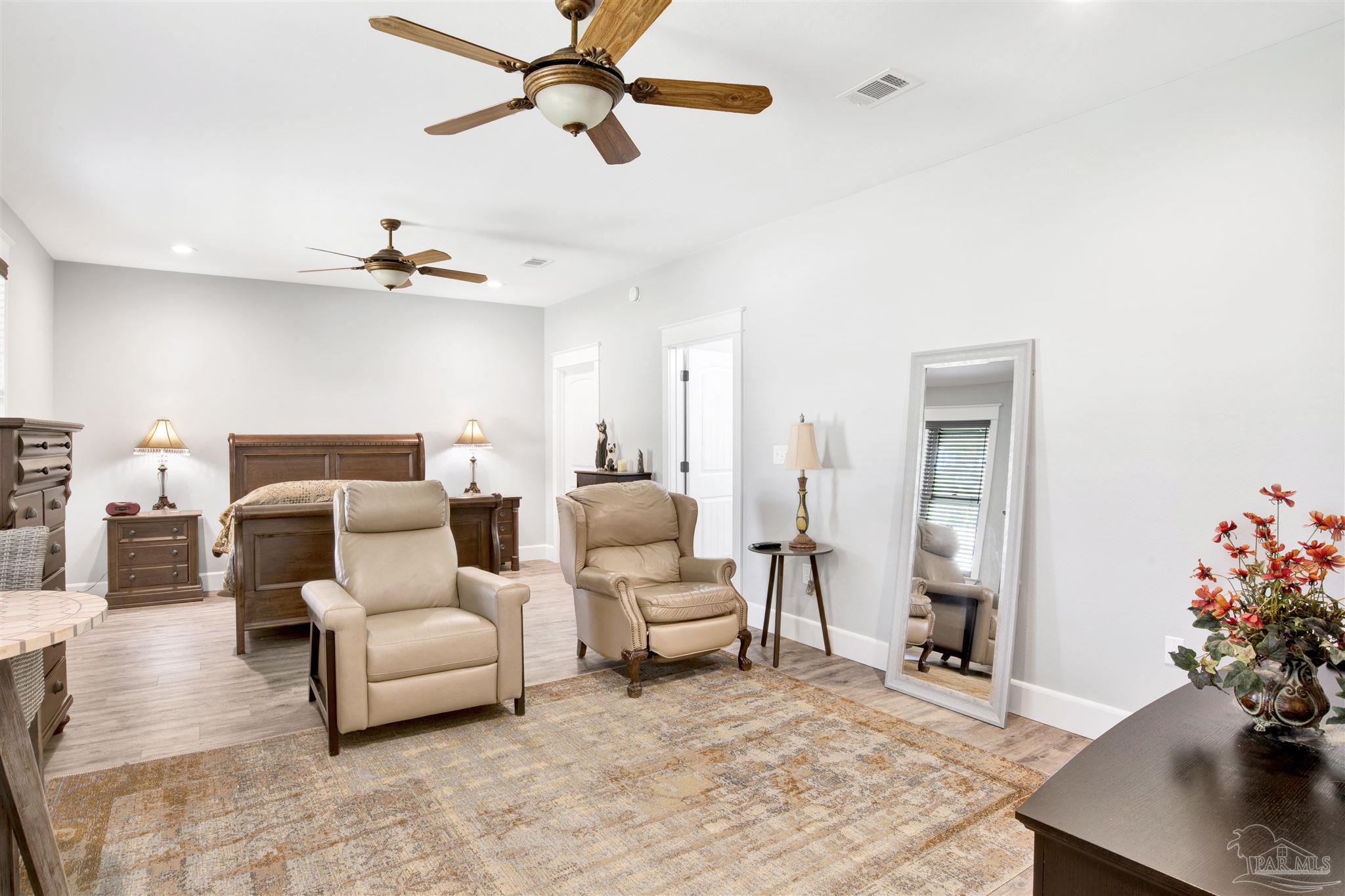2549 Santa Rosa Drive Lillian, AL 36549 - Photo 20 of 53 a living room with furniture and flowers