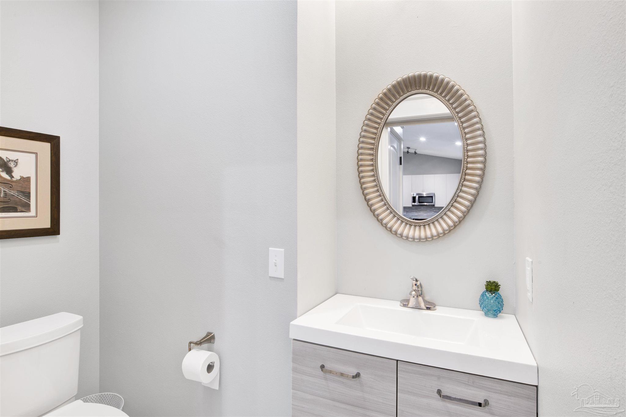 2549 Santa Rosa Drive Lillian, AL 36549 - Photo 24 of 53 a bathroom with a sink and a mirror