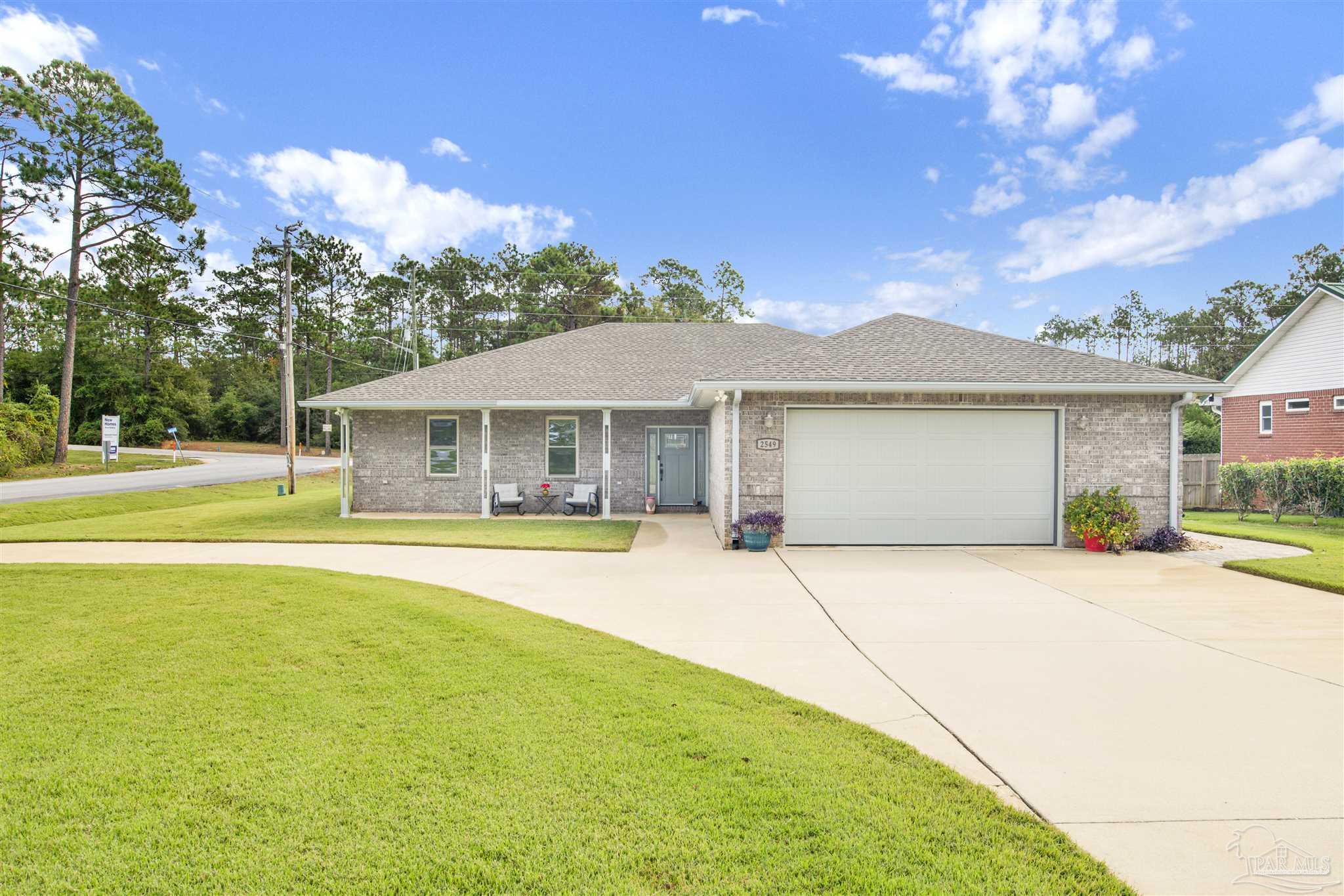2549 Santa Rosa Drive Lillian, AL 36549 - Photo 26 of 53 a front view of a house with yard and outdoor seating