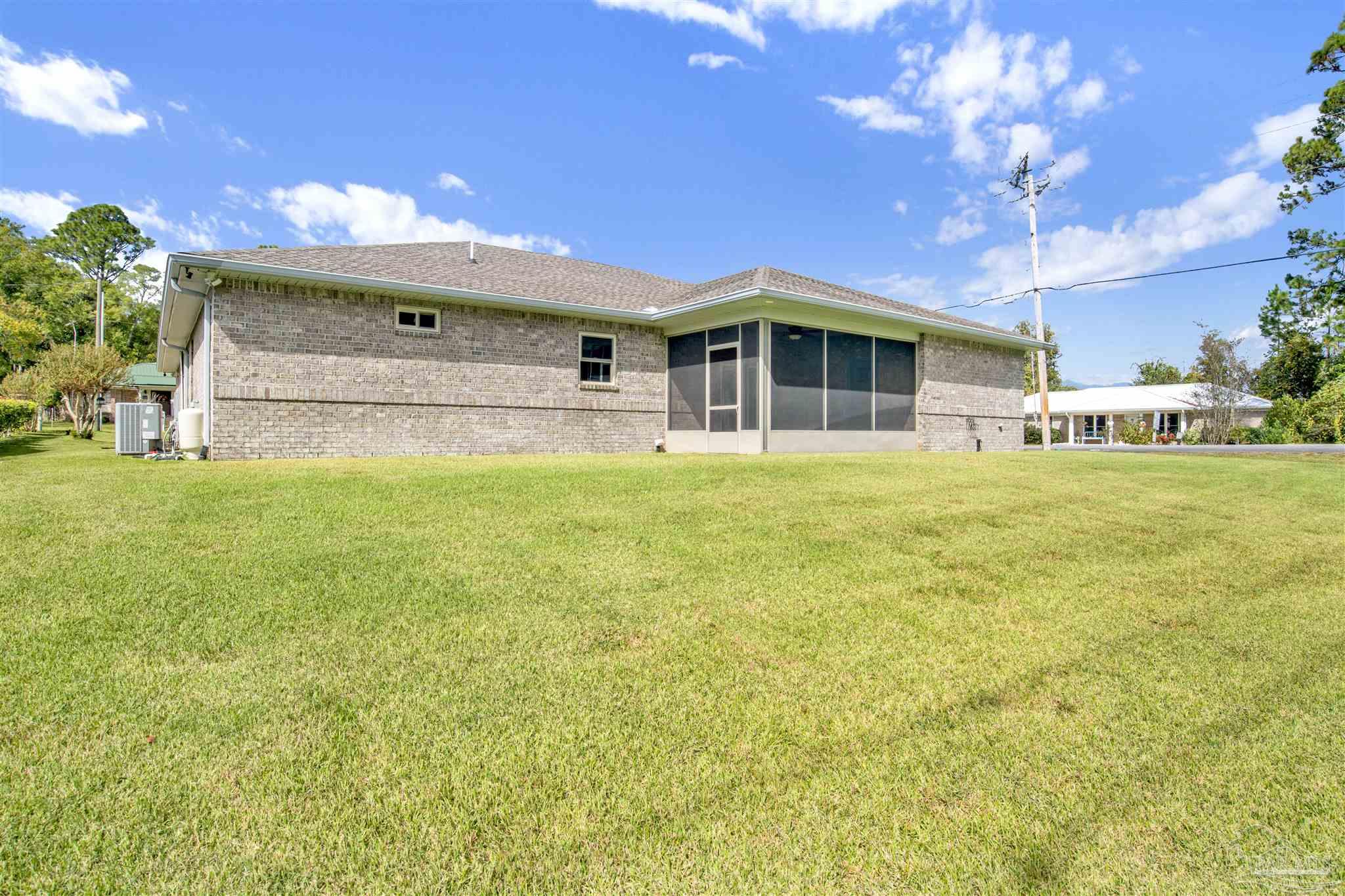 2549 Santa Rosa Drive Lillian, AL 36549 - Photo 28 of 53 a front view of a building with a yard