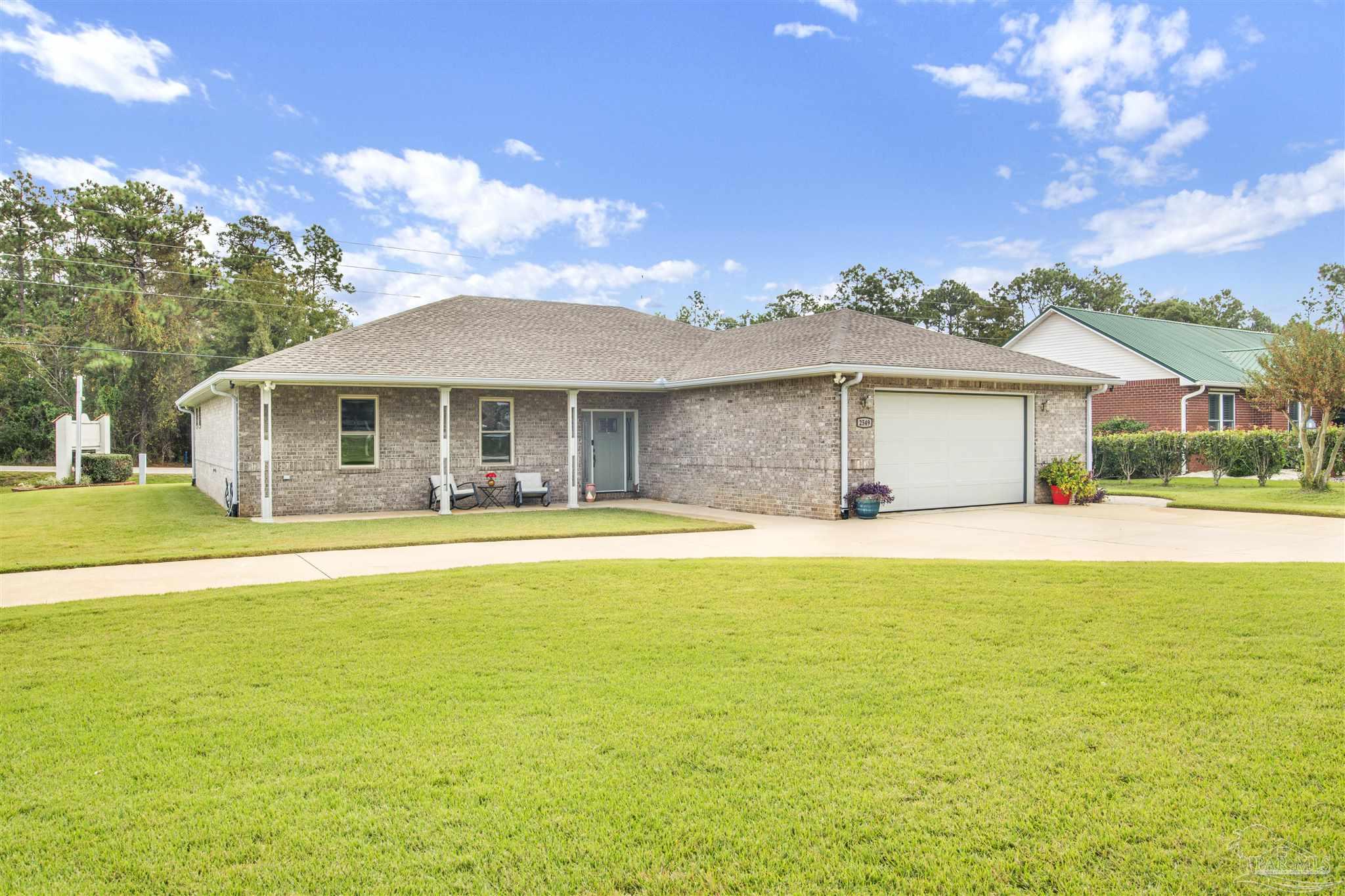 2549 Santa Rosa Drive Lillian, AL 36549 - Photo 46 of 53 a front view of a house with swimming pool having outdoor seating