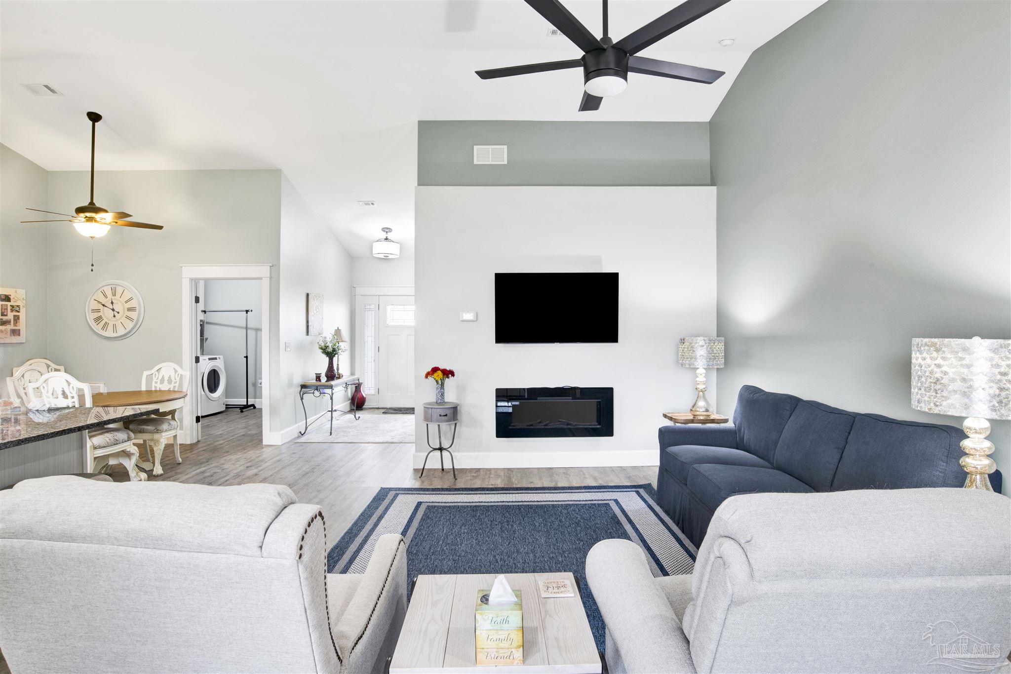 2549 Santa Rosa Drive Lillian, AL 36549 - Photo 5 of 53 a living room with furniture and a fireplace