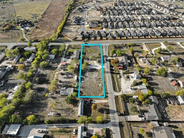 an aerial view of a building with parking space