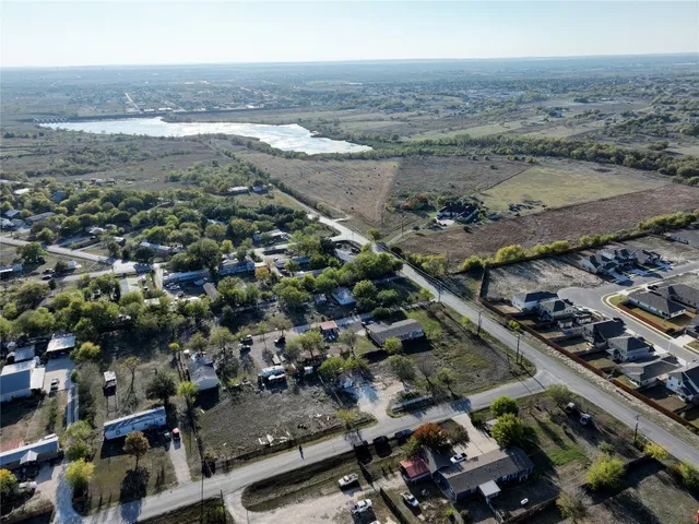 a view of a yard with swimming pool