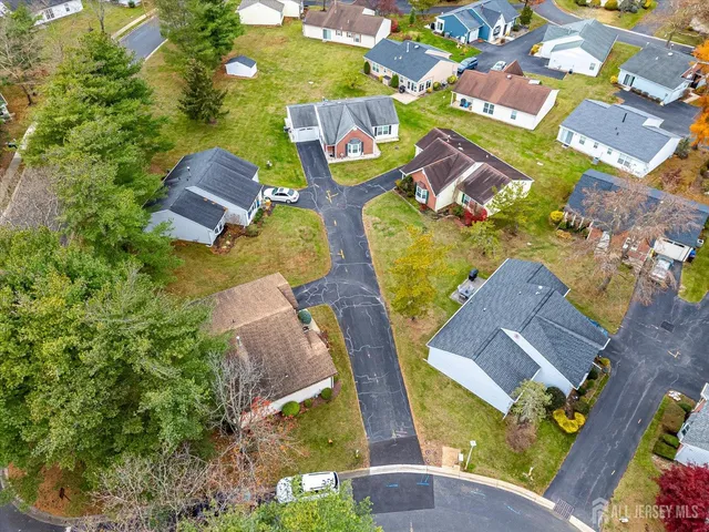 an aerial view of residential house with outdoor space and swimming pool