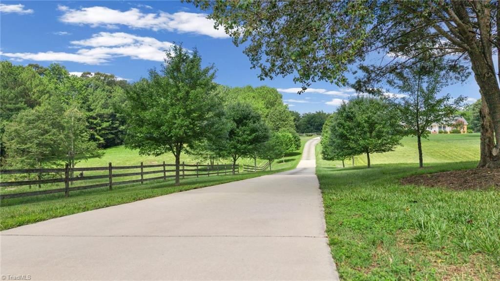 1044 Lasley Road Lewisville, NC 27023 - Photo 2 of 50 Beautiful curb appeal with timeless design and expansive grounds