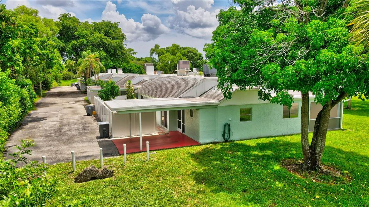 9285 Southwest 5th Street, Unit C Boca Raton, FL 33428 - Photo 1 of 31 a view of outdoor space yard and deck