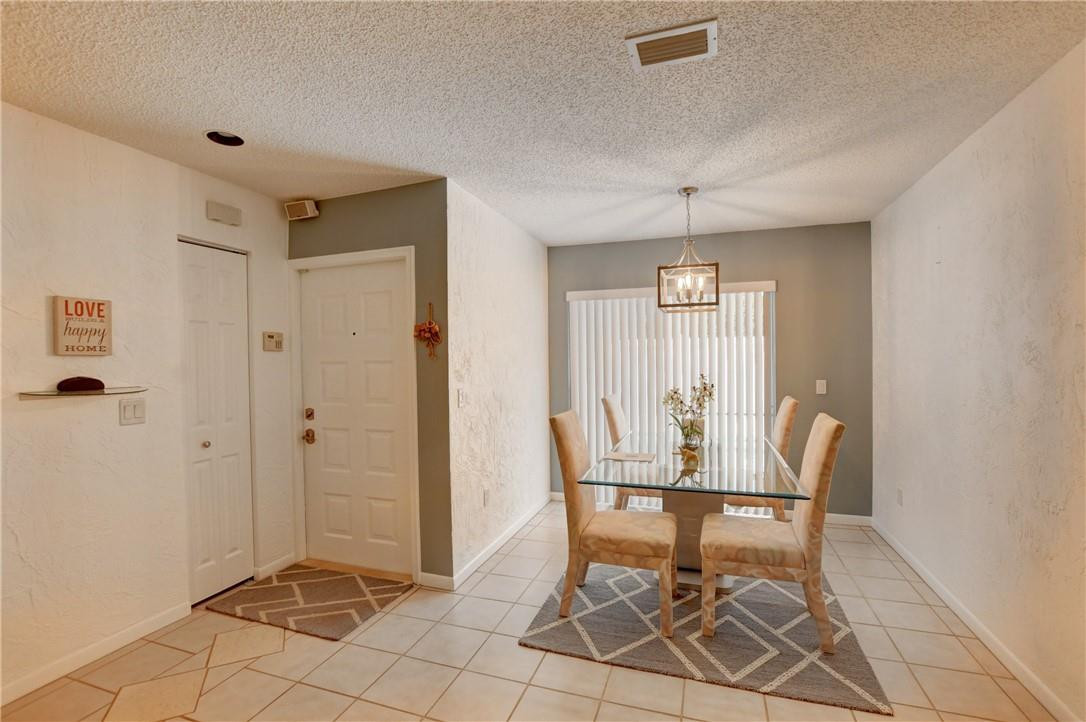 9285 Southwest 5th Street, Unit C Boca Raton, FL 33428 - Photo 15 of 31 a view of a room with furniture and window