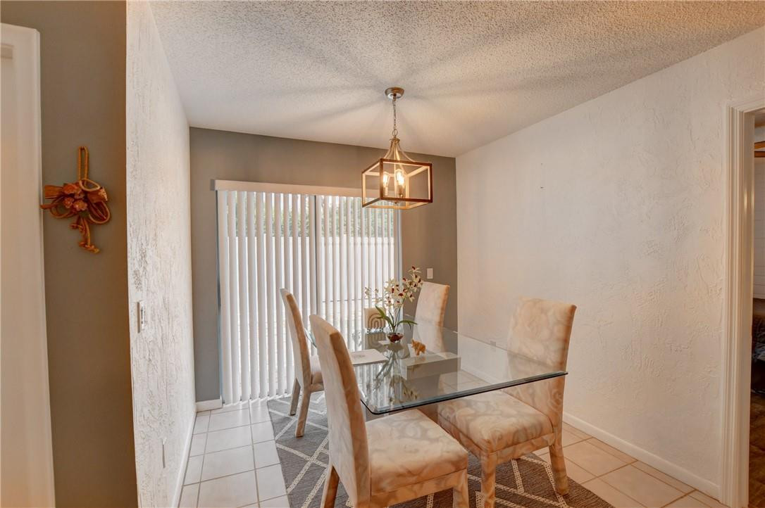 9285 Southwest 5th Street, Unit C Boca Raton, FL 33428 - Photo 16 of 31 a dining room with furniture and window