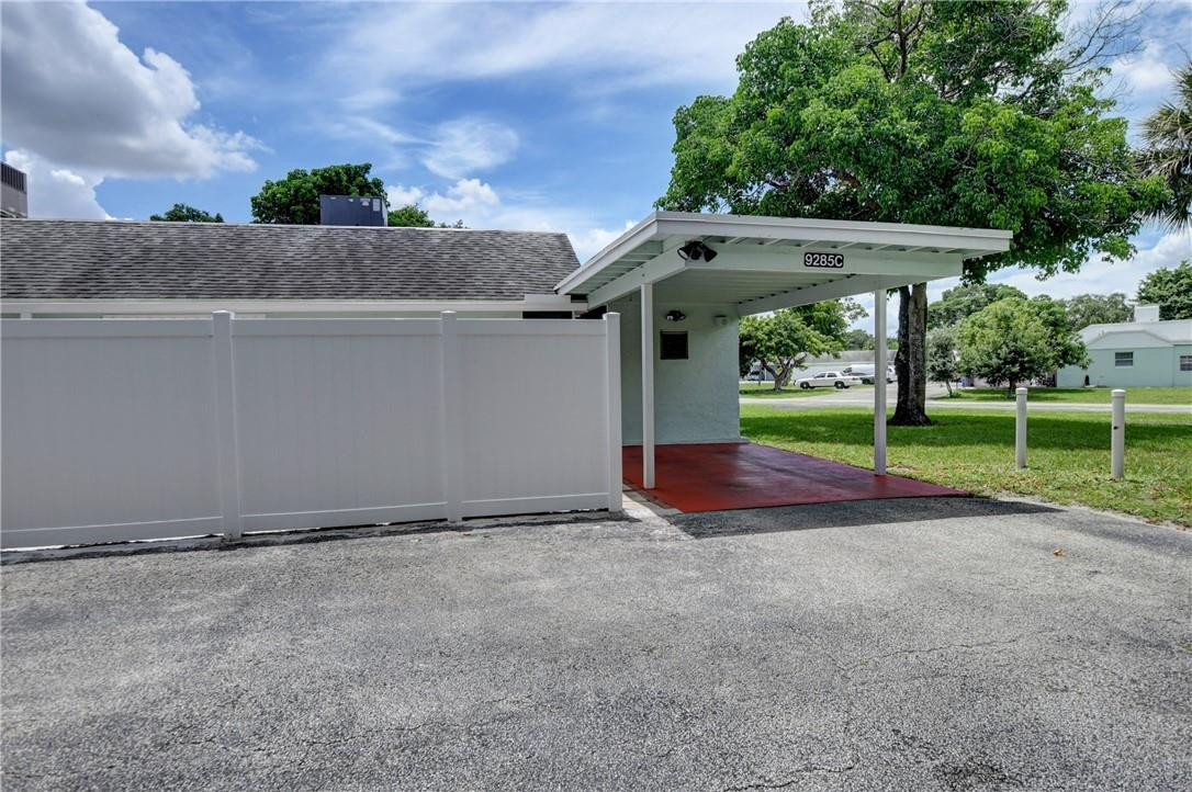 9285 Southwest 5th Street, Unit C Boca Raton, FL 33428 - Photo 5 of 31 a view of backyard with green space