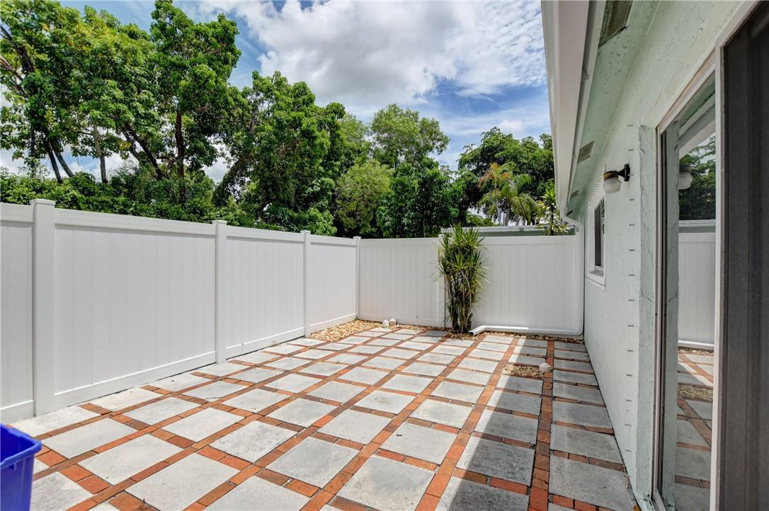 9285 Southwest 5th Street, Unit C Boca Raton, FL 33428 - Photo 7 of 31 a view of a backyard