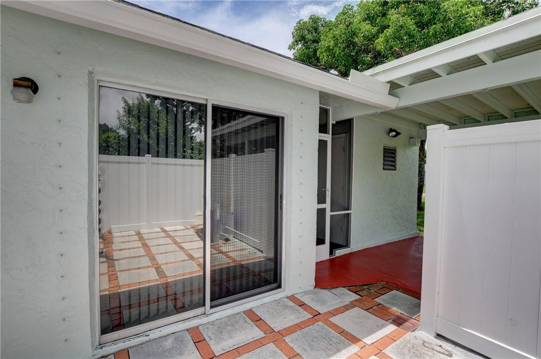 9285 Southwest 5th Street, Unit C Boca Raton, FL 33428 - Photo 9 of 31 a balcony view with a glass door