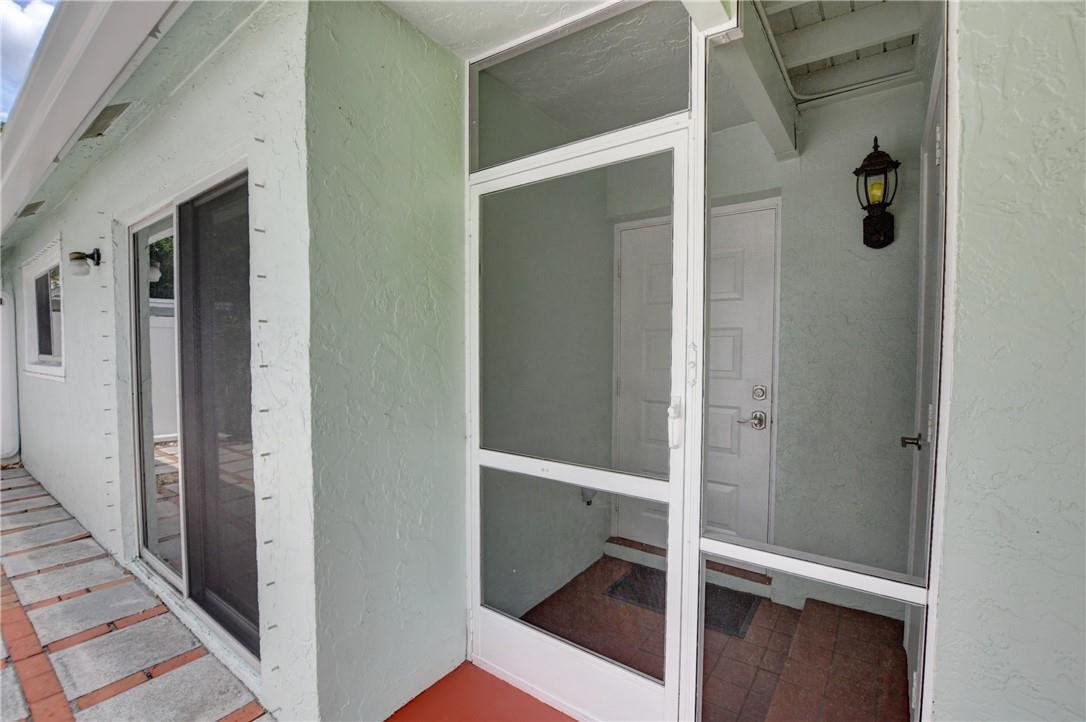 9285 Southwest 5th Street, Unit C Boca Raton, FL 33428 - Photo 10 of 31 a view of front door
