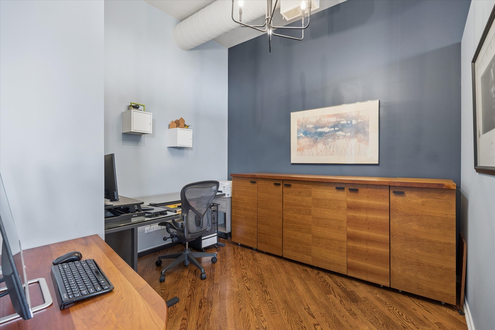 910 South Michigan Avenue, Unit 501 Chicago, IL 60605 - Photo 13 of 21 a view of workspace with wooden floor and bedroom