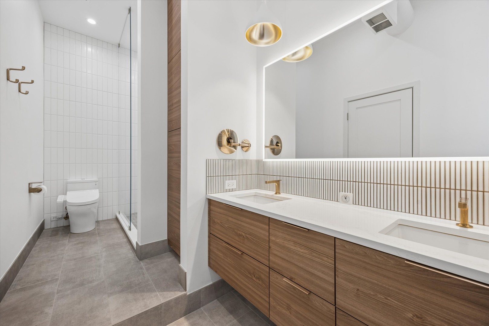 910 South Michigan Avenue, Unit 501 Chicago, IL 60605 - Photo 19 of 21 a spacious bathroom with a granite countertop sink a toilet and a shower