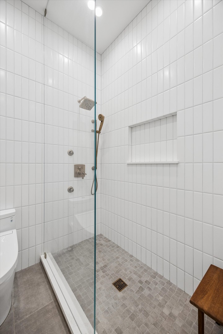910 South Michigan Avenue, Unit 501 Chicago, IL 60605 - Photo 20 of 21 a bathroom with a shower and a toilet