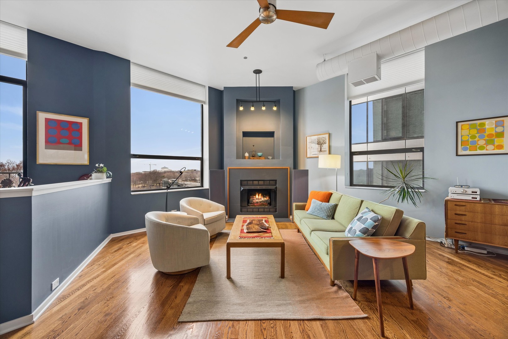 910 South Michigan Avenue, Unit 501 Chicago, IL 60605 - Photo 5 of 21 a living room with furniture and a fireplace