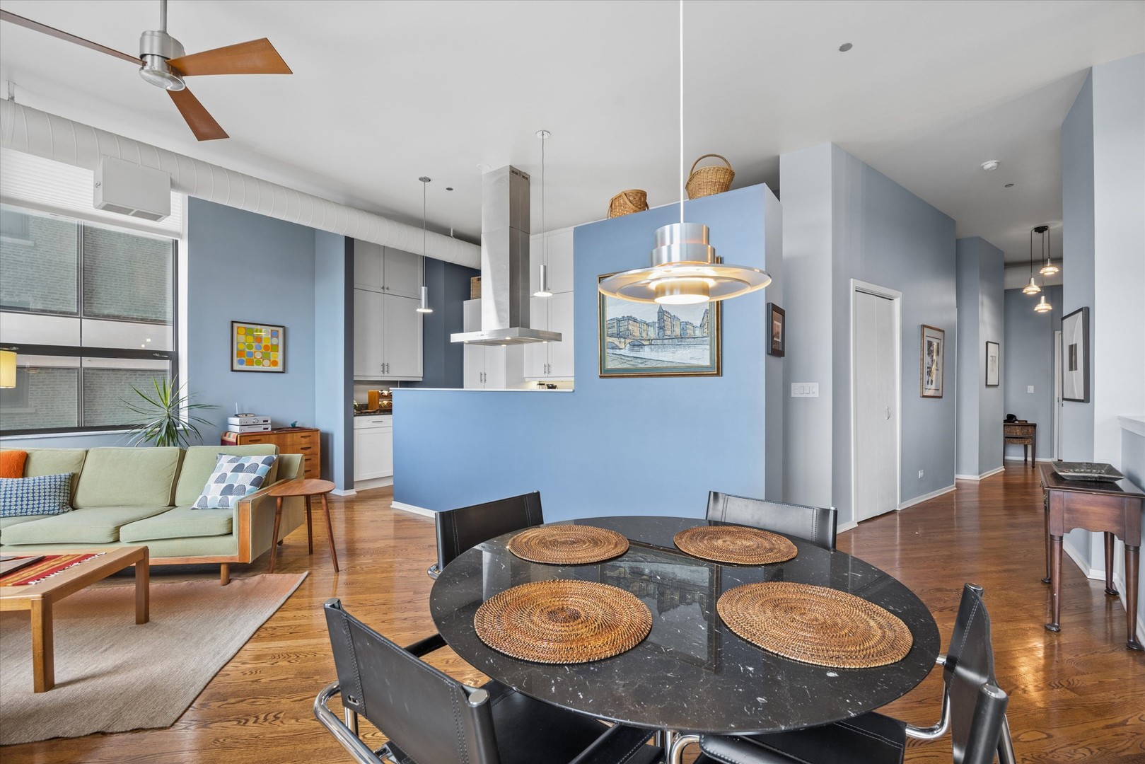 910 South Michigan Avenue, Unit 501 Chicago, IL 60605 - Photo 7 of 21 a living room with furniture and wooden floor