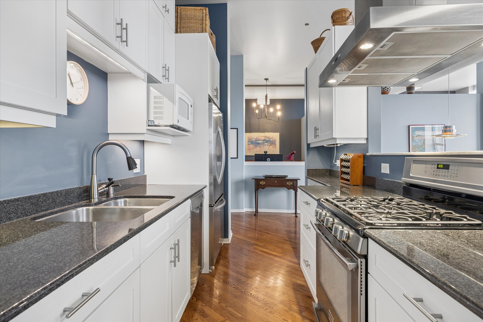 910 South Michigan Avenue, Unit 501 Chicago, IL 60605 - Photo 10 of 21 a kitchen with stainless steel appliances granite countertop a sink stove and cabinets