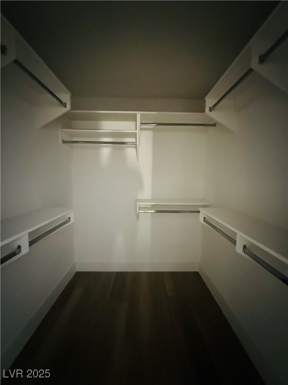 2200 South Fort Apache Road, Unit 2095 Las Vegas, NV 89117 - Photo 11 of 16 Walk in closet with dark wood-style floors