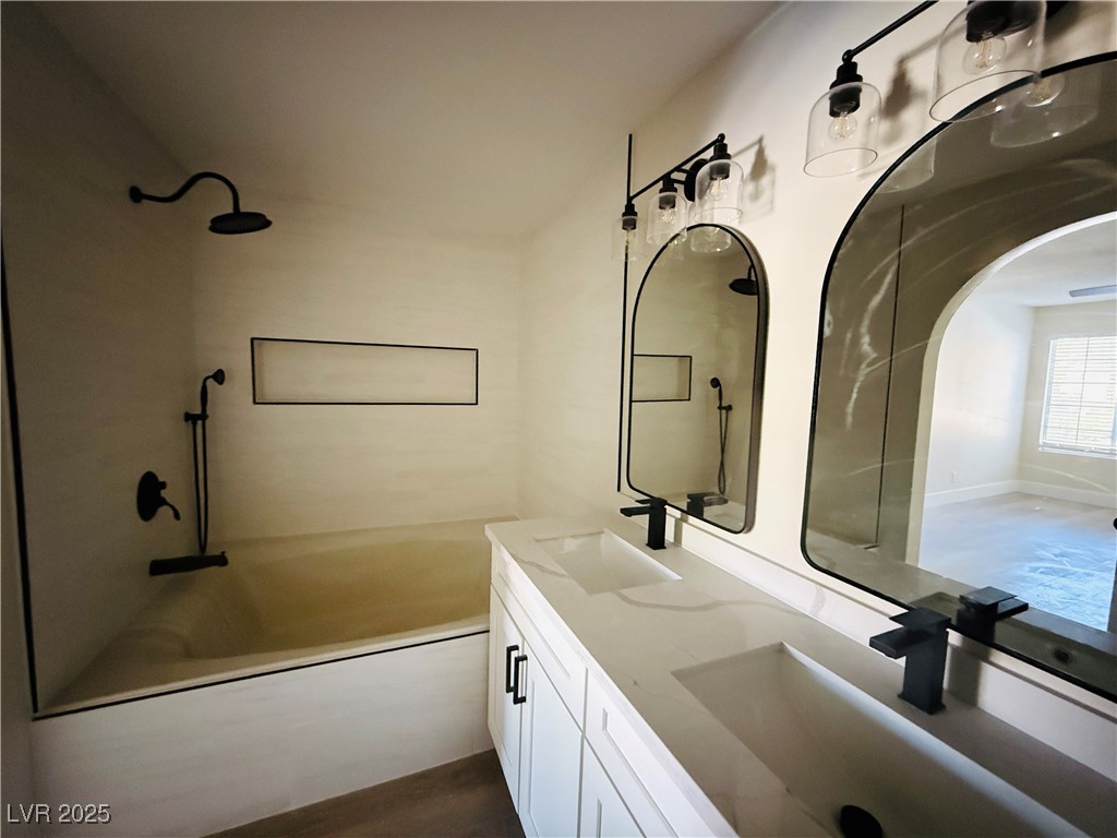 2200 South Fort Apache Road, Unit 2095 Las Vegas, NV 89117 - Photo 13 of 16 Full bath featuring shower / bath combination, double vanity, and dark wood-style flooring