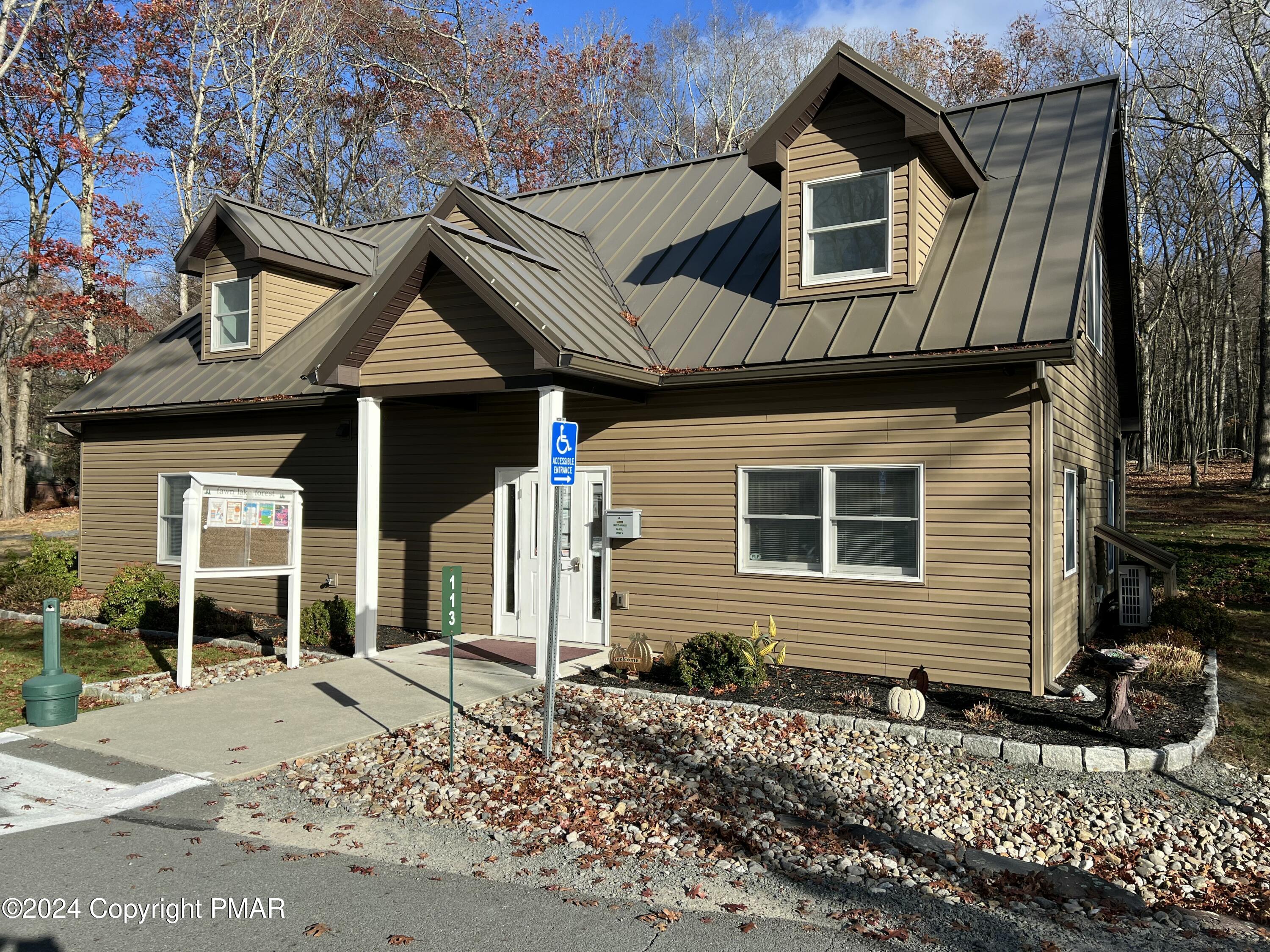 229 Forest Ridge Drive Hawley, PA 18428 - Photo 6 of 10 a front view of a house with a yard