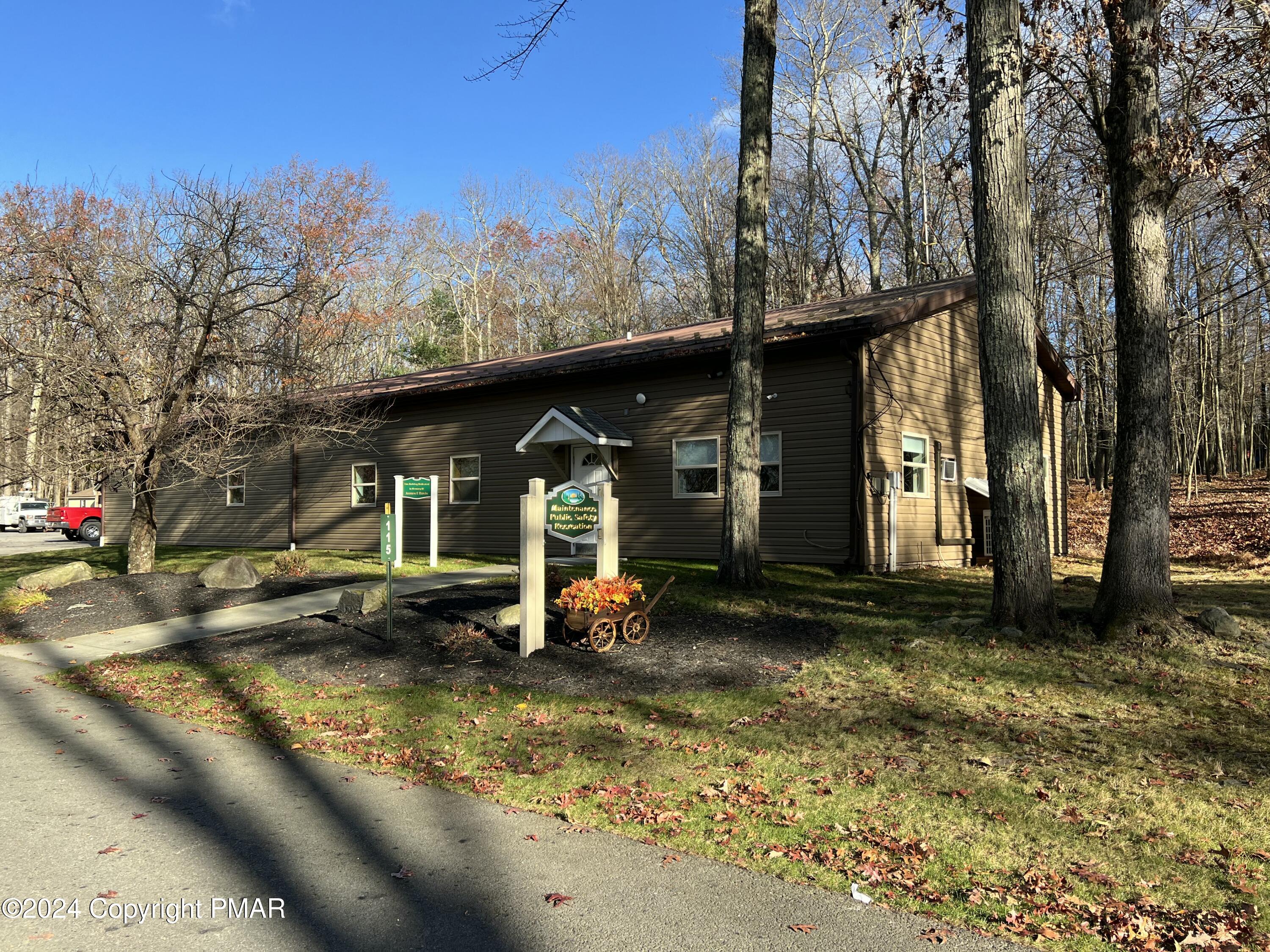 229 Forest Ridge Drive Hawley, PA 18428 - Photo 7 of 10 a view of a house with a yard porch and sitting area