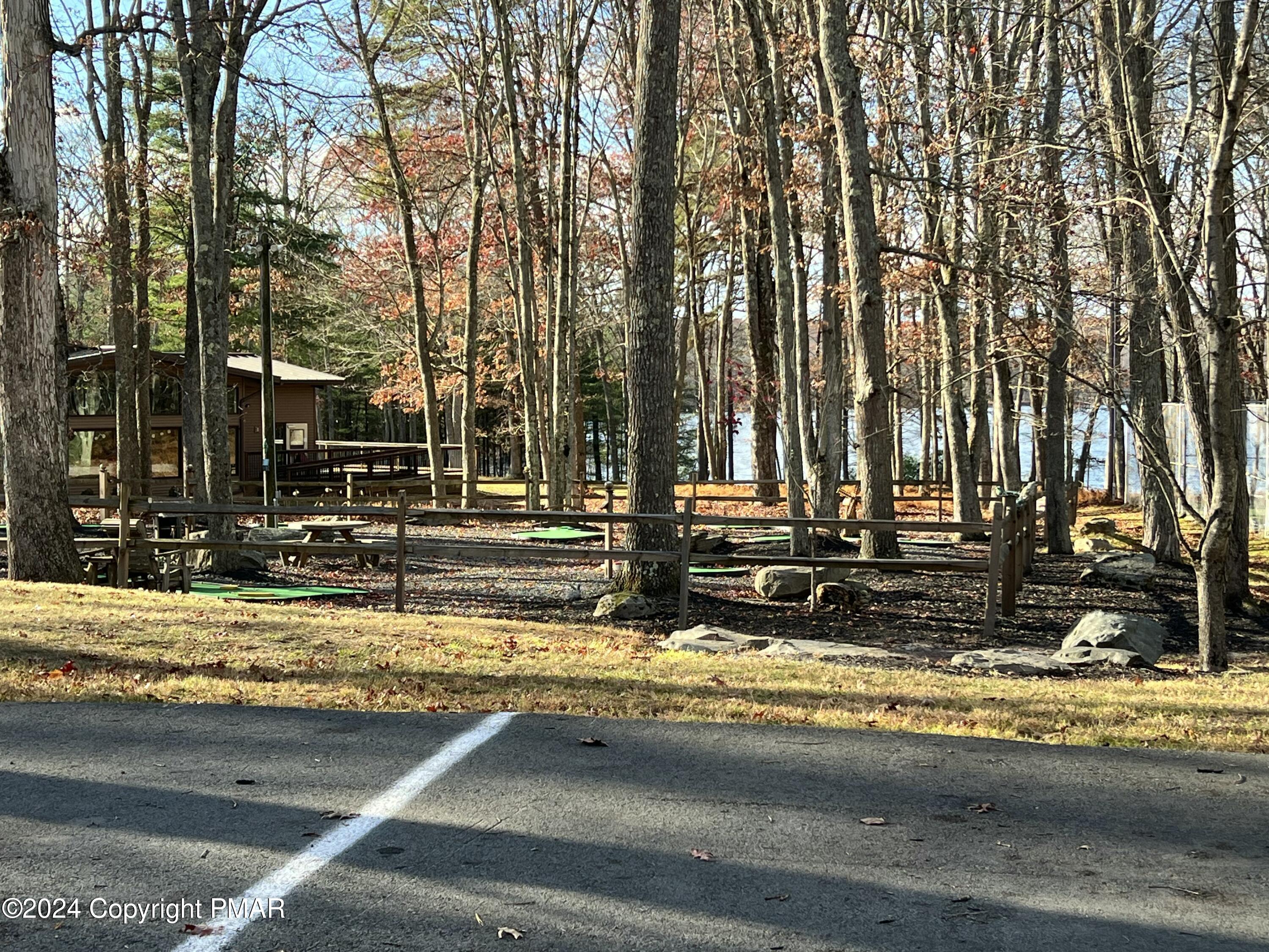 229 Forest Ridge Drive Hawley, PA 18428 - Photo 8 of 10 a view of swimming pool with trees