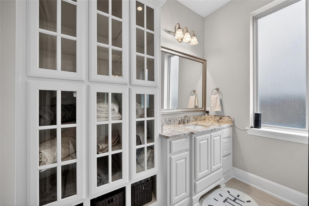 1039 Stephen Street Allen, TX 75013 - Photo 27 of 40 Full bathroom featuring vanity and light wood-style floors