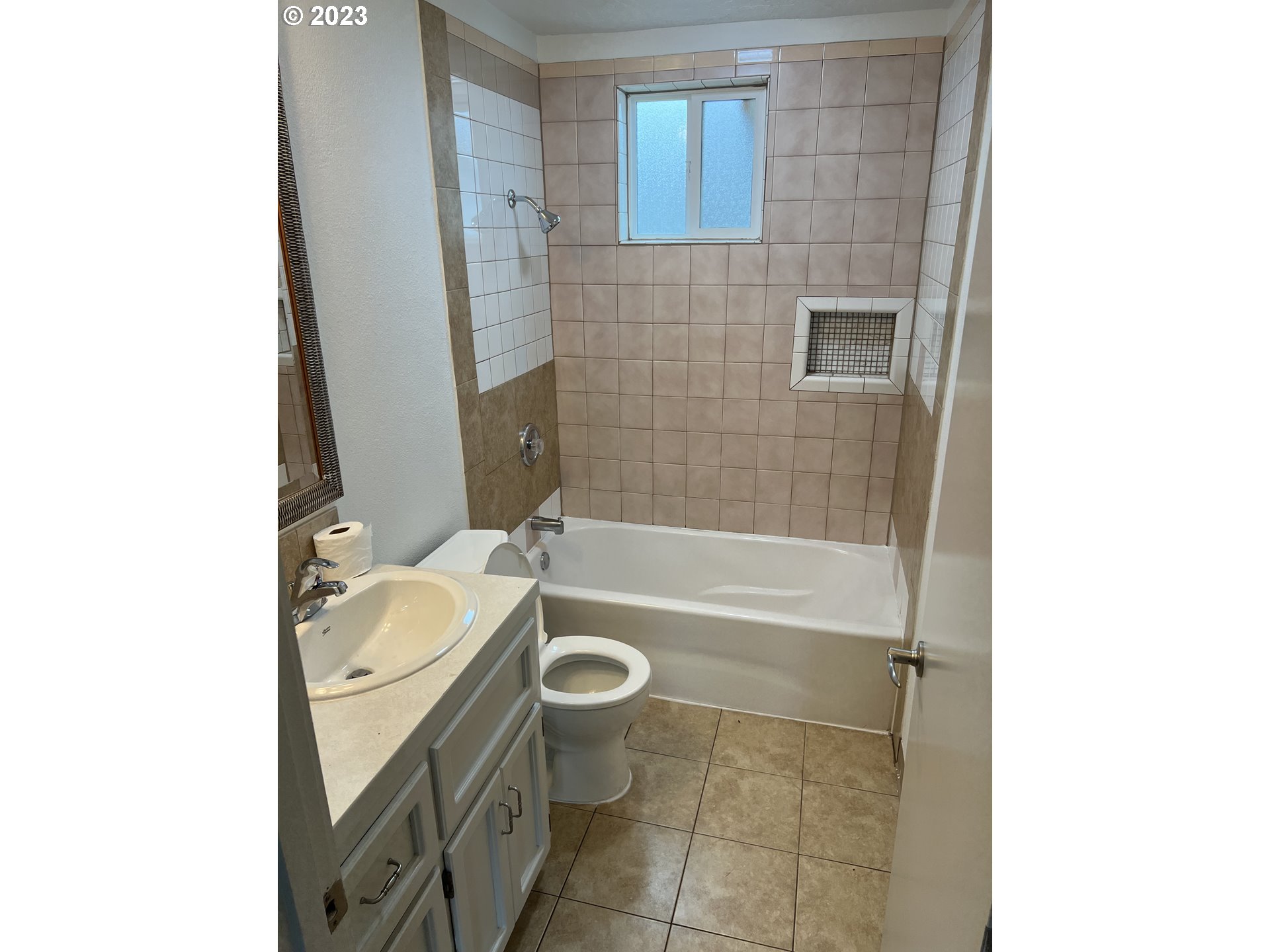 365 North 24th Street Springfield, OR 97477 - Photo 9 of 14 a bathroom with a granite countertop bathtub shower sink mirror vanity and toilet